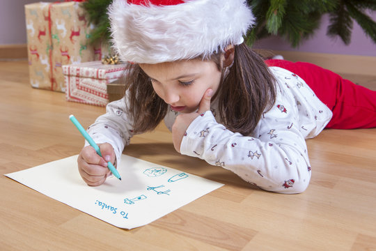 Little girl preparing The Santa Letter