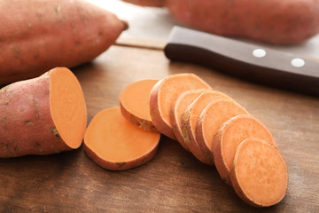 Sliced sweet potato on wooden table