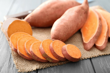 Sliced sweet potato on wooden table