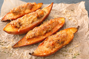 Yummy stuffed sweet potato on kitchen table