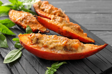 Wooden board with yummy stuffed sweet potato