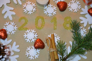 2018 with christmas decoration. concept of the new year and christmas. gold figures 2018 on the background of snowflakes anise in the form of a flower background with a background. on kraft paper