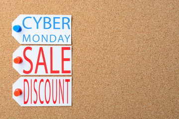 Cyber Monday sale tags are pinned to the cork board