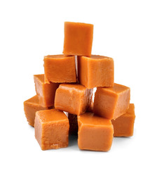 Sweet caramel candies on white background