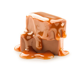 Sweet chocolate candies with caramel topping on white background