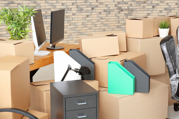 Carton boxes with stuff in room. Office move concept