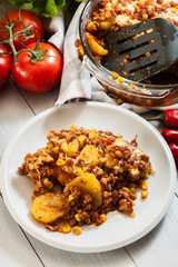 Portion of mexican potato casserole with minced meat