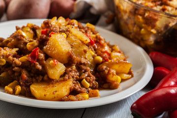 Portion of mexican potato casserole with minced meat