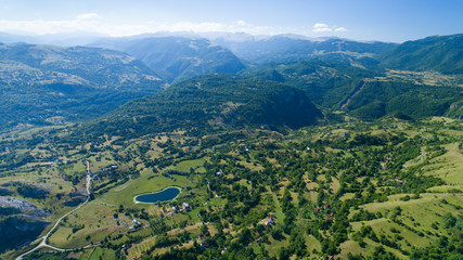 Aerial view Komarnica river canyon and the road to Zabljak