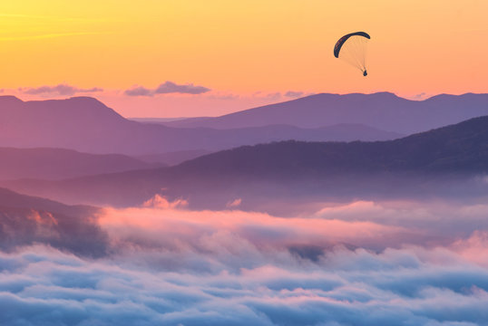 Paraglider over the sunset in a Crimea mountains
