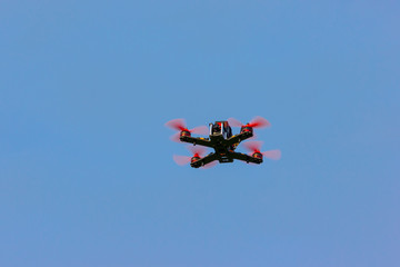 Naklejka na ściany i meble Race drone in flight 