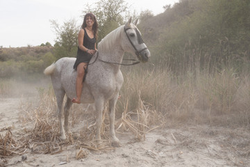 young woman on horseback