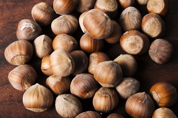 hazelnuts on wooden background