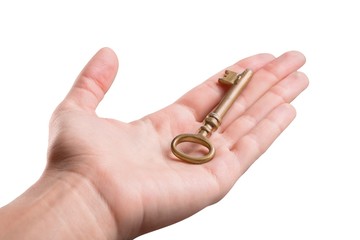 Hand Holding an Old Key