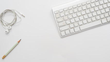 Office desk table with keyboard Top view and earphone