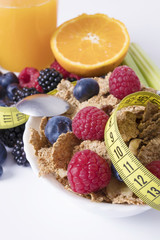fruits with cereals and tape measure, diet concept