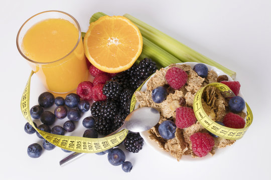 fruits with cereals and tape measure, diet concept