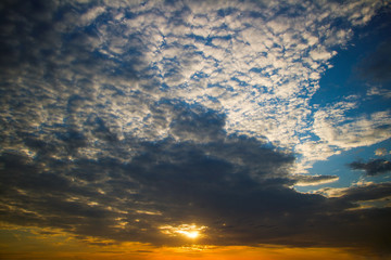Dramatic sunset with clouds.