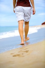 Closeup of a Person Walking on the Beach