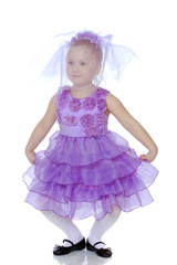 Little girl in purple dress.