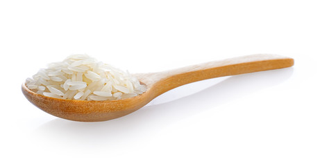 rice in wooden spoon isolated on white background