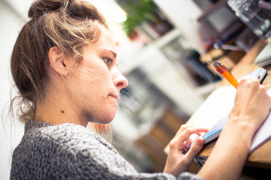 Young Woman Studying And Handwriting