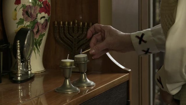 Lighting Jewish Candlestick