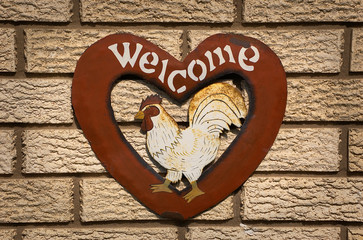 Metal art craft heart shaped welcome sign with chicken painted