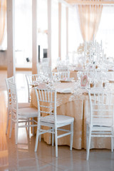 White decorative chairs in the wedding restaurant.