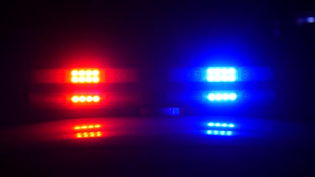 Flashing lights of the police car at night