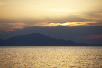 Sunset over the mountains and sea