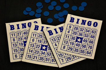 Bingo game cards, four with blue ink