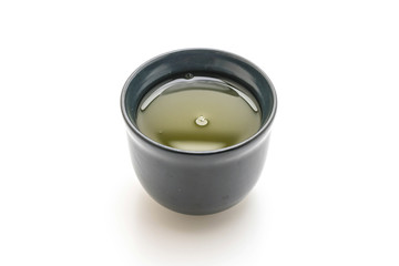 hot green tea on white background