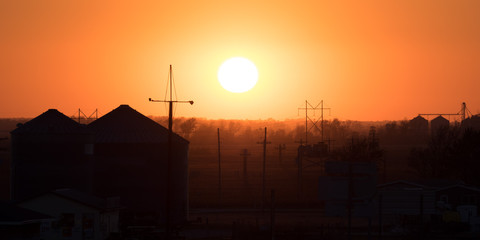 Sunset over Farm community in Midwest