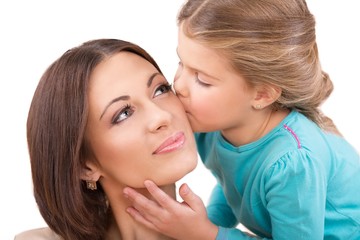 Closeup of a Young Daughter Kissing Her Mother
