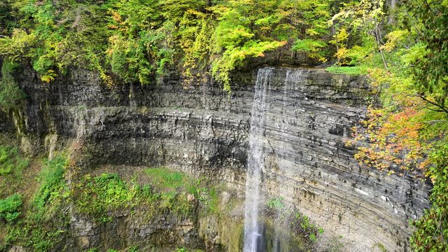 The amazing 41 metre ribbon waterfall, Tew's falls found in Hamilton, Ontario, Canada, in the fall of 2017, flowing. Static close up shot in 4K with sound.