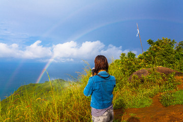 lady try to catch the rainbow on Pha Hin Dum viewpoint
