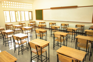 Lecture room or School empty classroom with desks and chair iron wood in high school thailand, interior of