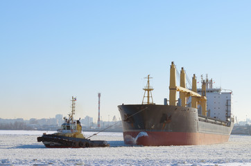 Towing a big tanker.