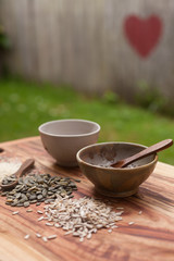 mixed seeds on wooden background