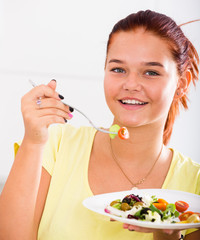 girl enjoying salad