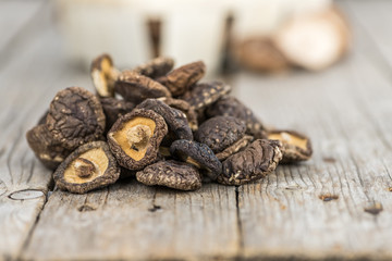 Wooden table with Dried Shiitake, selective focus