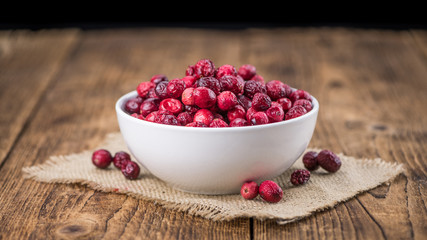 Some fresh Dried Cranberries (selective focus; close-up shot)