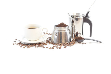 Coffee, stove top coffee maker, beens and a hot cup of coffee on isolated background