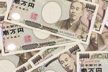 Close up of Japanese currency yen bank notes. 10,000 Japanese Yen