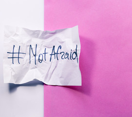 The piece of Crumpled paper with hashtag: NOT AFRAID. do not be afraid of your desires.