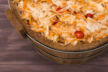sour cabbage in oak barrel, top view