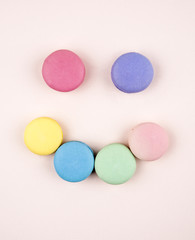 smile face macaroons on pink background
