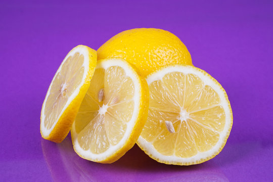 Lemon on purple background