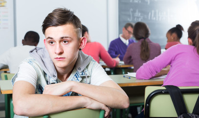 ﻿lonely school pupil sitting